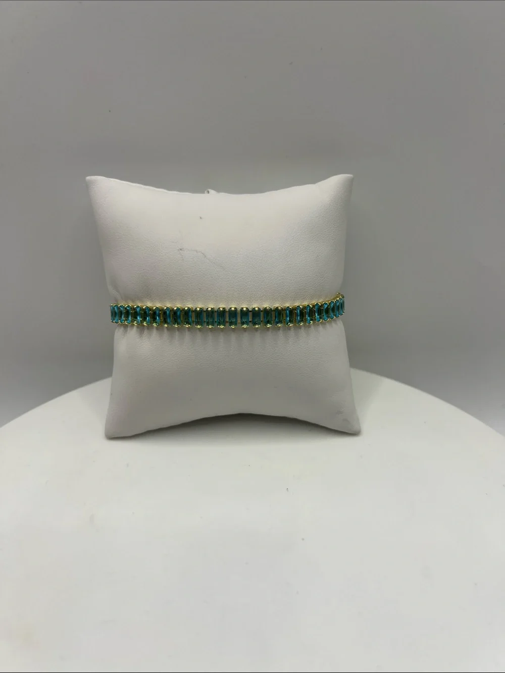 524. 18k Gold Plated over Brass Bracelet with Aquamarine Cubic Zirconias 7”